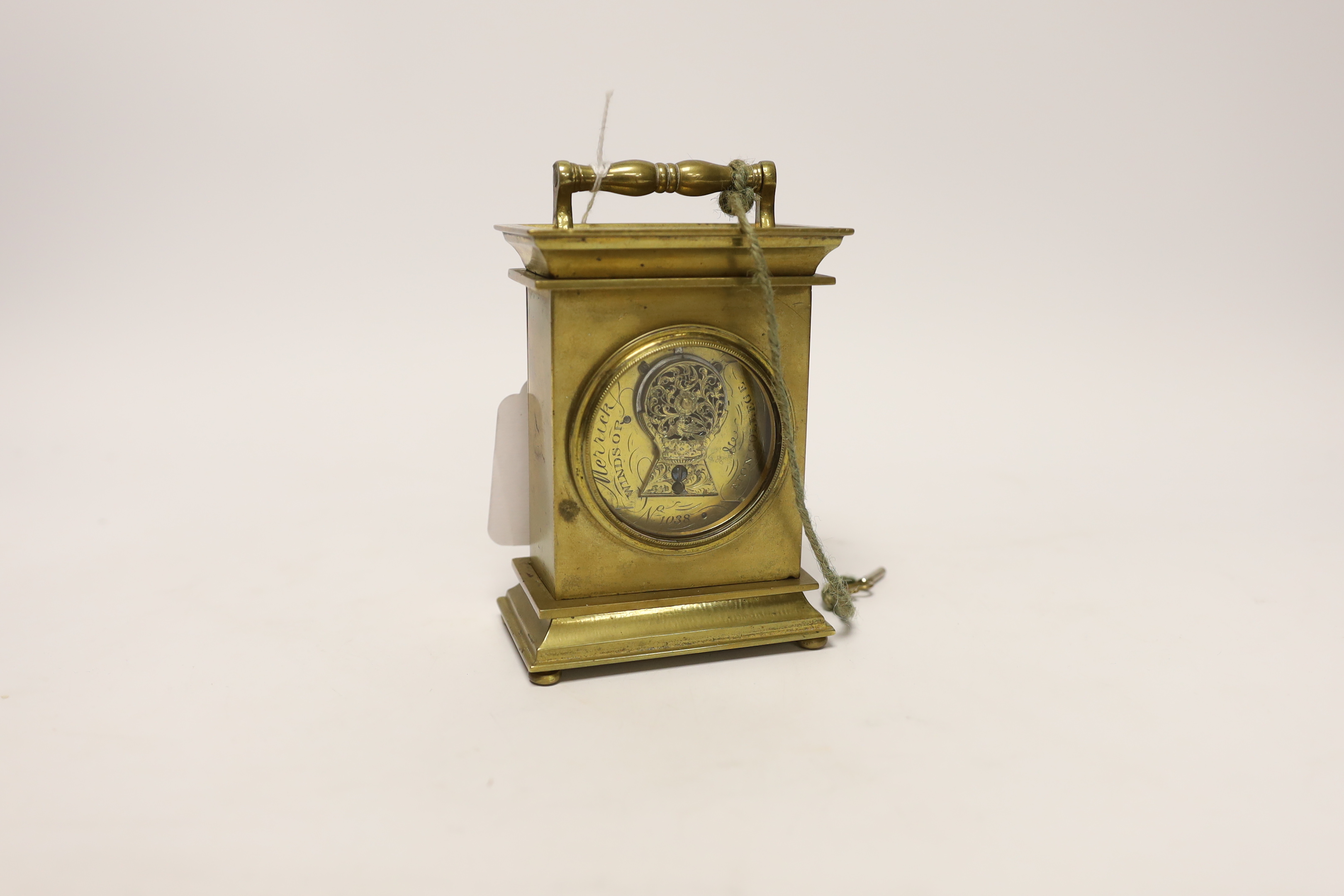 A brass carriage timepiece with machine turned face, signed to the backplate Merrick, Windsor, 11.5cm high